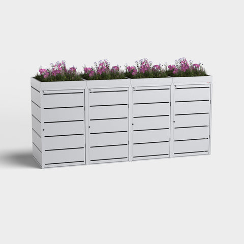 Mülltonnenbox Dagobert 4er 240L RAL9006 mit Pflanzdach und lila Blumen.