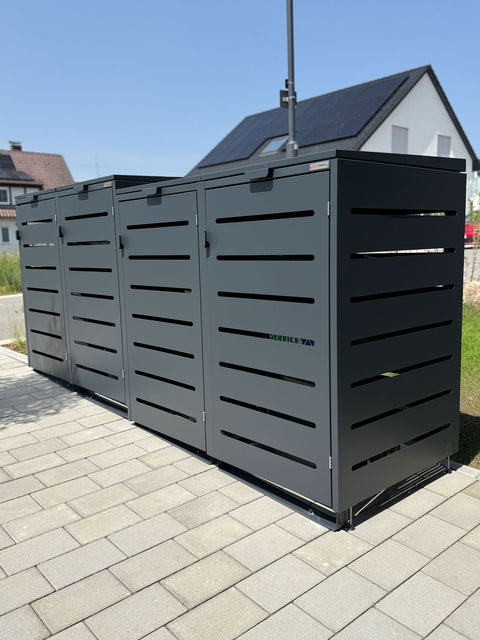 BIO Stefan Alubert Mülltonnenbox 4er 240l in Anthrazit mit Deckelgefälle vor modernem Wohnhaus
