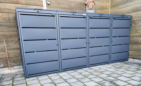 BIO Stefan Dagobert Mülltonnenbox 4er 240l in Anthrazit vor Holzsichtschutzwand im Außenbereich