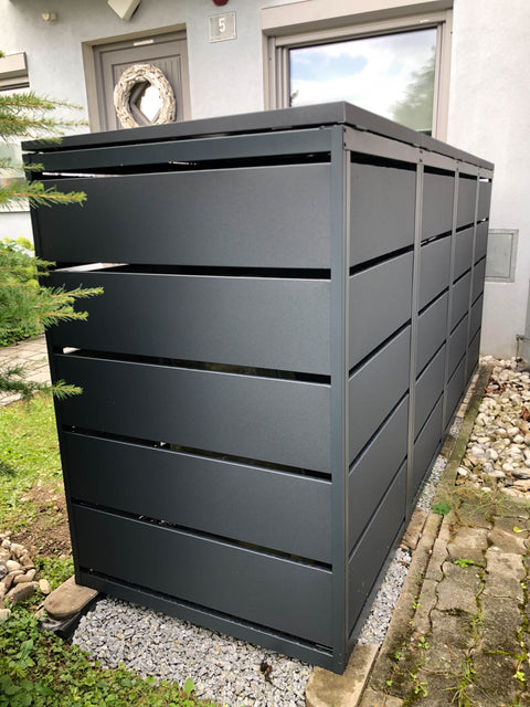 BIO Stefan Dagobert Mülltonnenbox 4er 240l in Anthrazit vor Hausfassade auf Kiesfläche