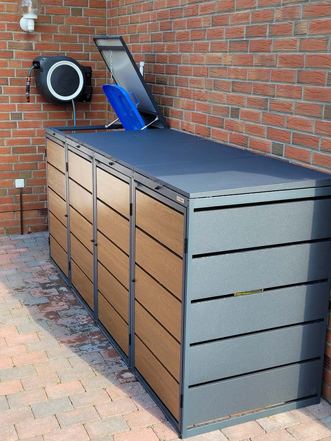 BIO Stefan Dagobert Mülltonnenbox 4er 240l in Anthrazit mit Holzoptik-Front, seitlich an Backsteinwand