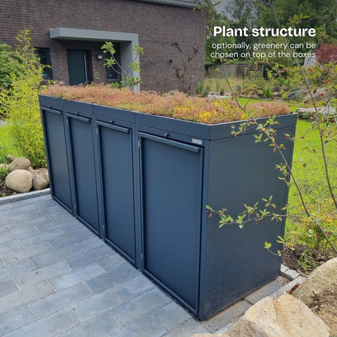 Stahlfred Waste garbage can box with plant canopy, in front of a modern brick house.