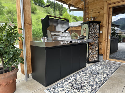 Miele Dreams on the Chalet Terrace: Grill, Cooktop and Storage in Black with Mountain Views