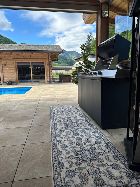 Miele Dreams on the Chalet Terrace: Grill, Cooktop and Storage in Black with Mountain Views