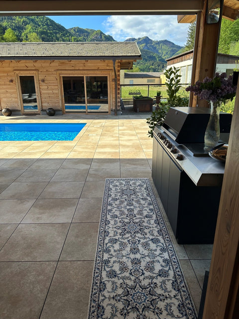 Miele Dreams on the Chalet Terrace: Grill, Cooktop and Storage in Black with Mountain Views