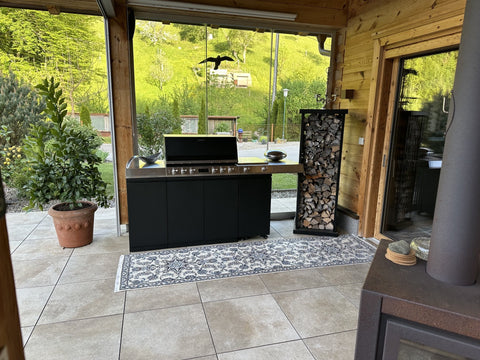 Miele Dreams on the Chalet Terrace: Grill, Cooktop and Storage in Black with Mountain Views