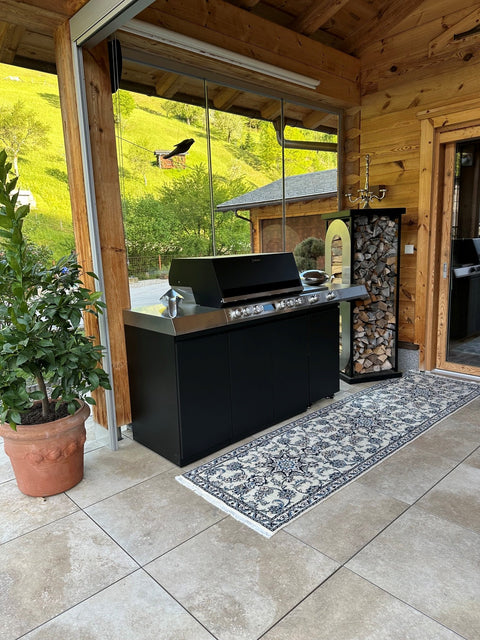 Miele Dreams on the Chalet Terrace: Grill, Cooktop and Storage in Black with Mountain Views
