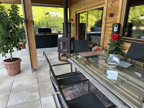 Miele Dreams on the Chalet Terrace: Grill, Cooktop and Storage in Black with Mountain Views